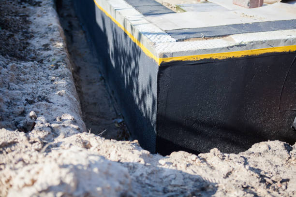 Professional Basement Waterproofing technician working in Andover, MN